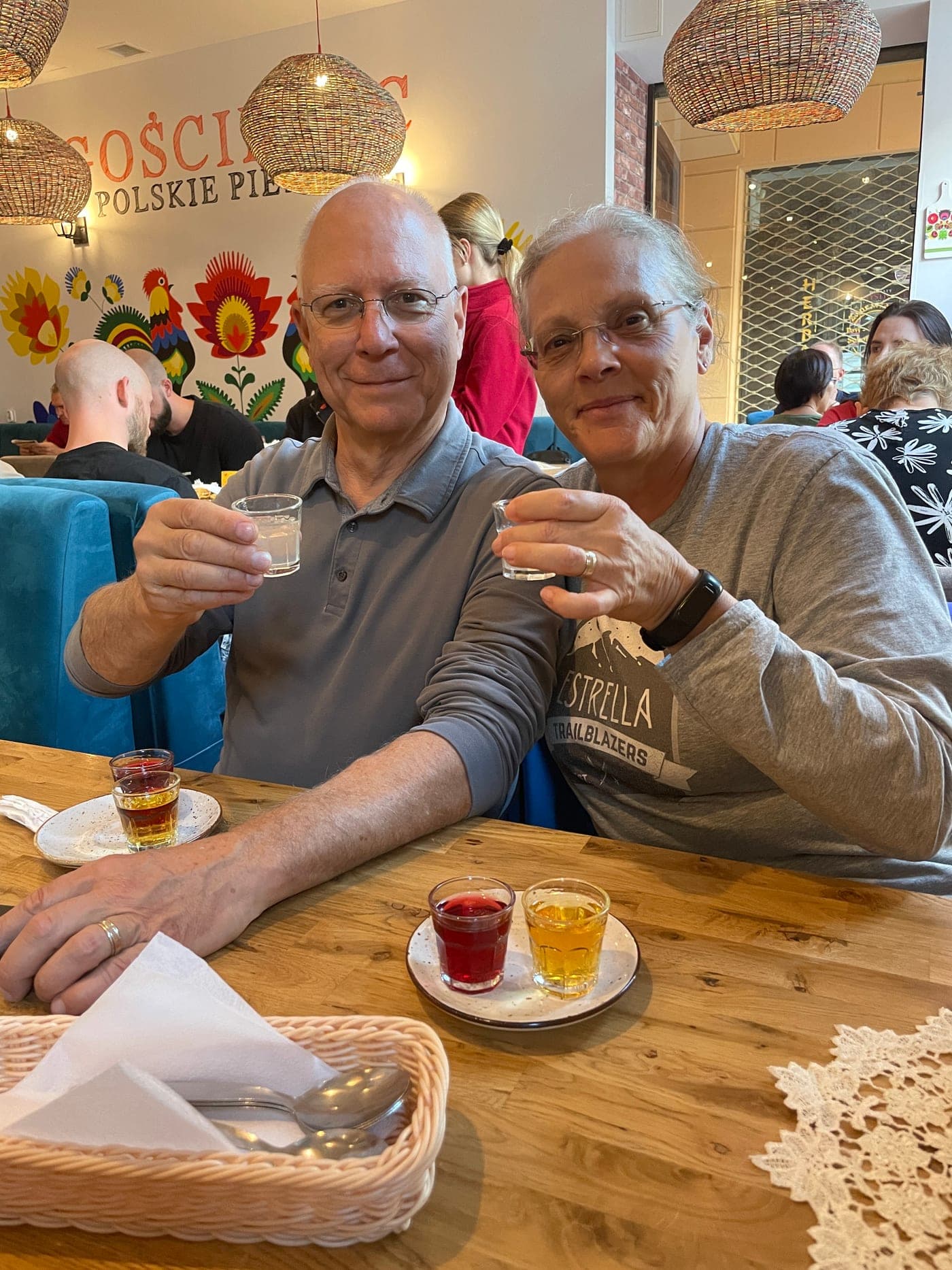 Guests enjoying vodka tasting in a traditional Polish setting